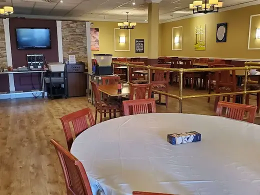 Bright dining area with wooden tables at Resource Recovery Center of Orange County, detox center in Bronx.