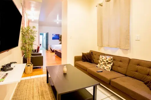 Cozy living room with modern furnishings at Transcend Recovery Community, a sober living home in Bronx.