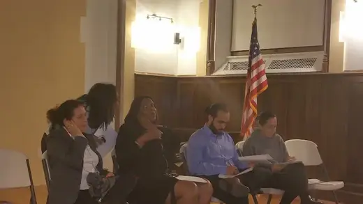 Group discussion in a community room at Concourse House, a sober living home in Bronx.